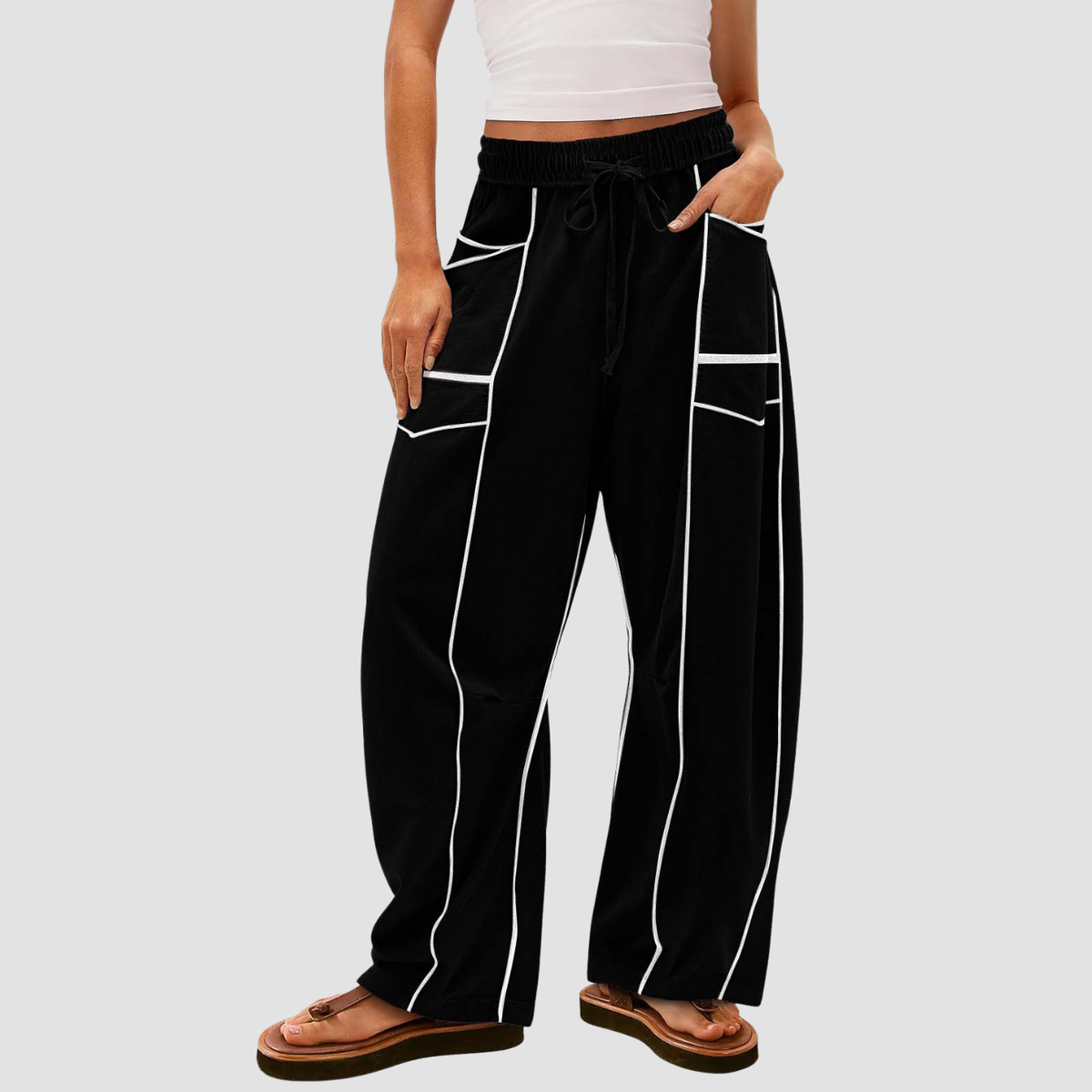 Noir | Pantaloni a gamba larga a righe