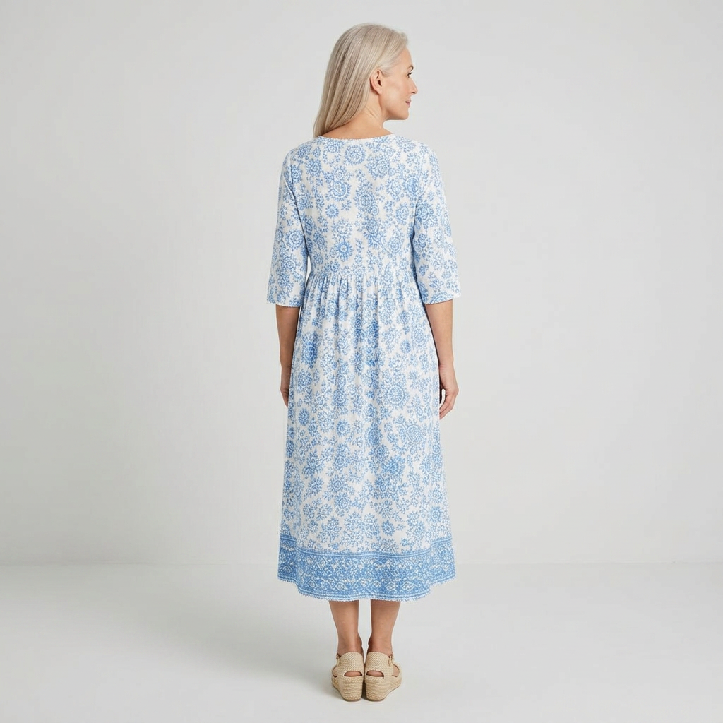 Vestido midi blanco con estampado floral azul - vista trasera
